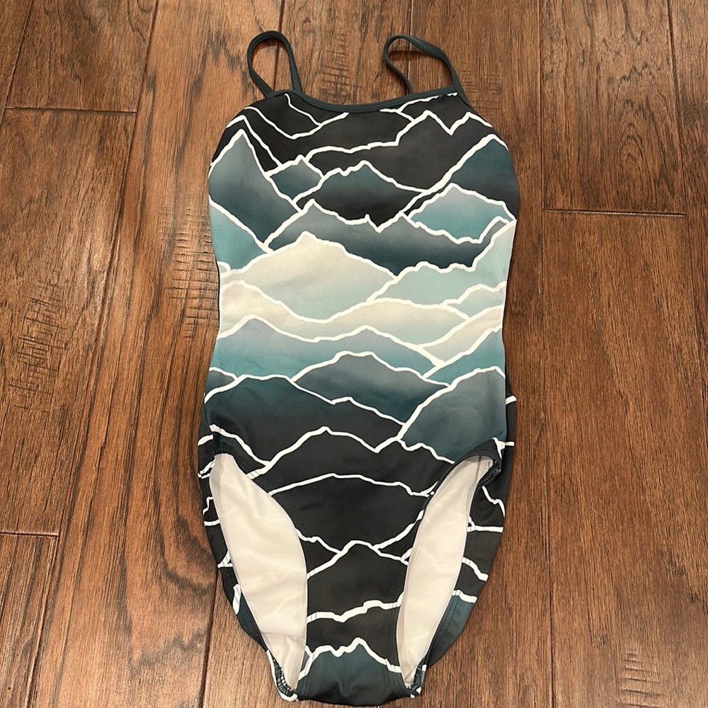 An Eleve leotard in the Renae Mountains style in size x-small.